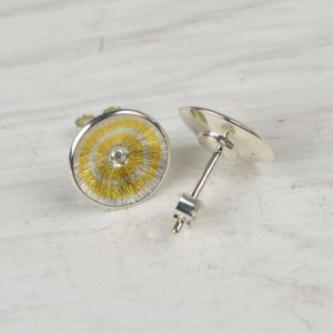 sterling silver and fine gold studs with diamonds