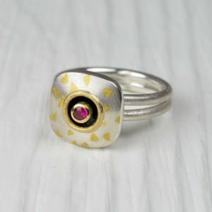 sterling silver, 18ct gold and finegold ring with ruby