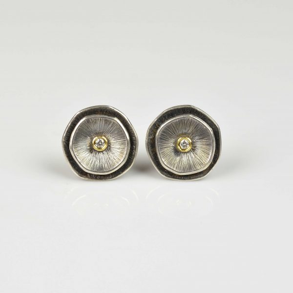 silver and 18ct gold studs with diamond