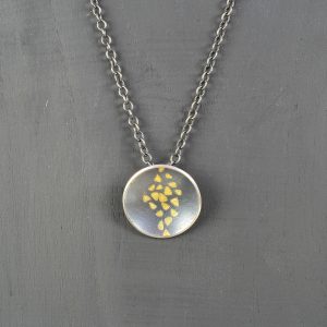 silver and finegold pendant and chain
