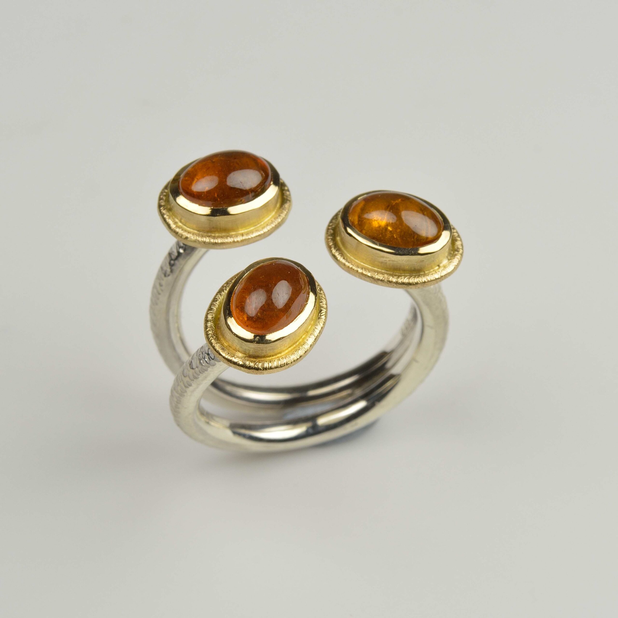 Silver and 18ct gold mandarin garnet ring